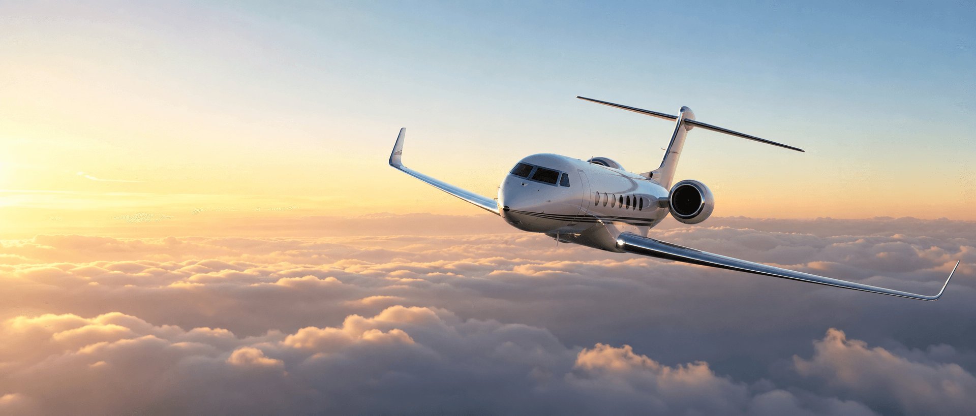 A commercial aircraft flying above clouds